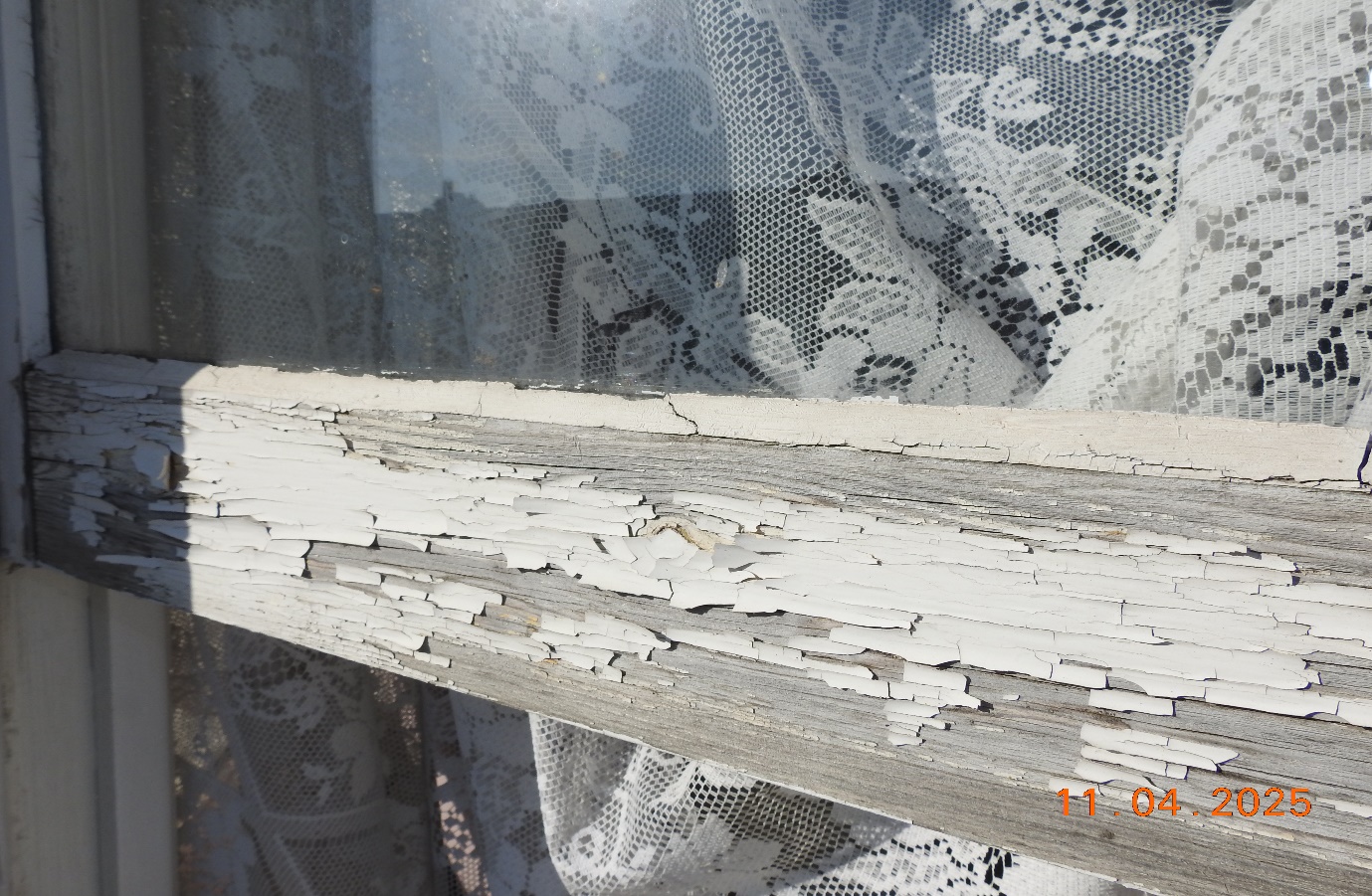 Cracked peeling external decorations bare timber.