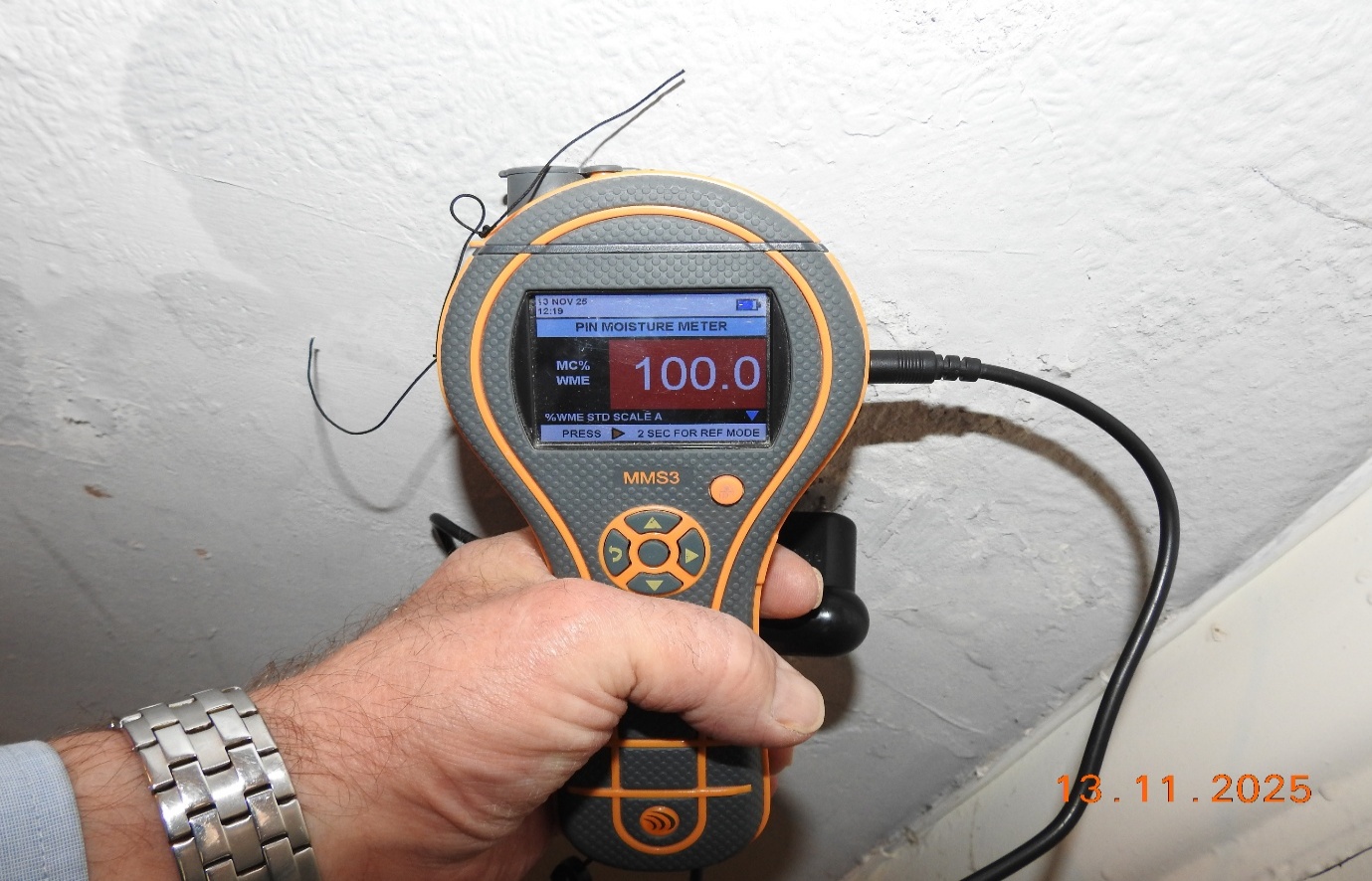 Wet wall plaster, moisture reading 100% WME (wet).