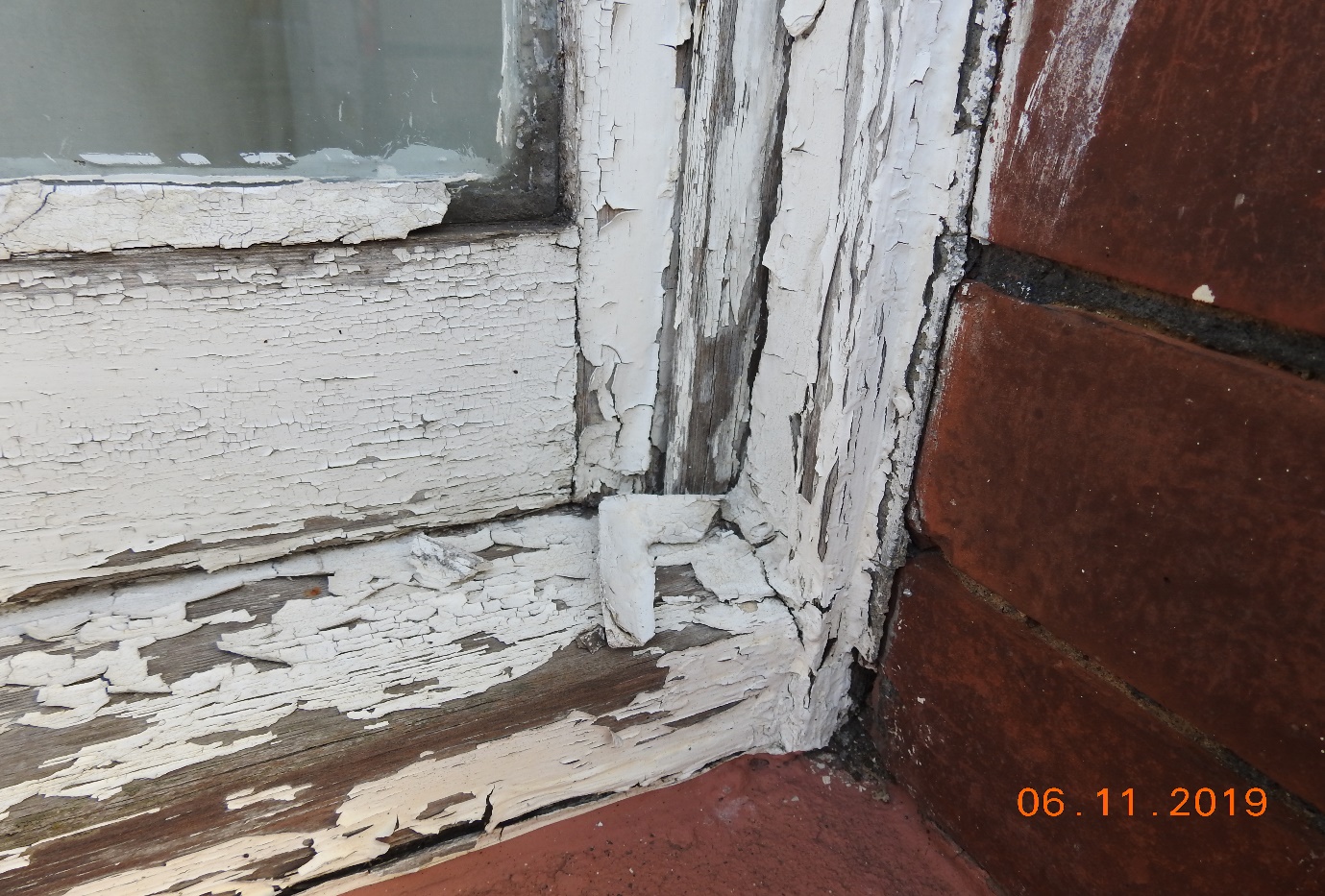 Local Authority, cracked and peeled external decorations.